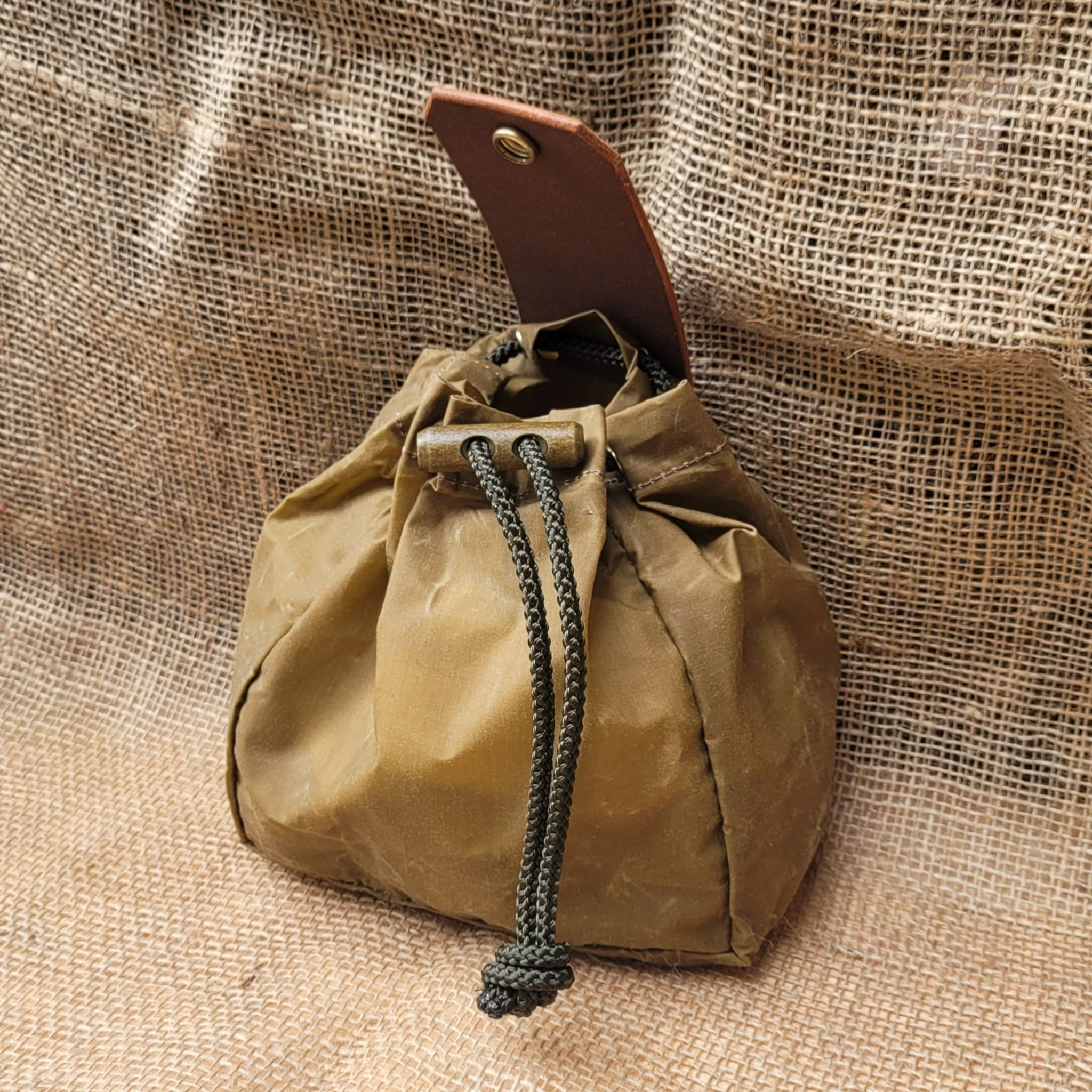 Forager dump pouch made from wax canvas and leather, used for foraging in the woods