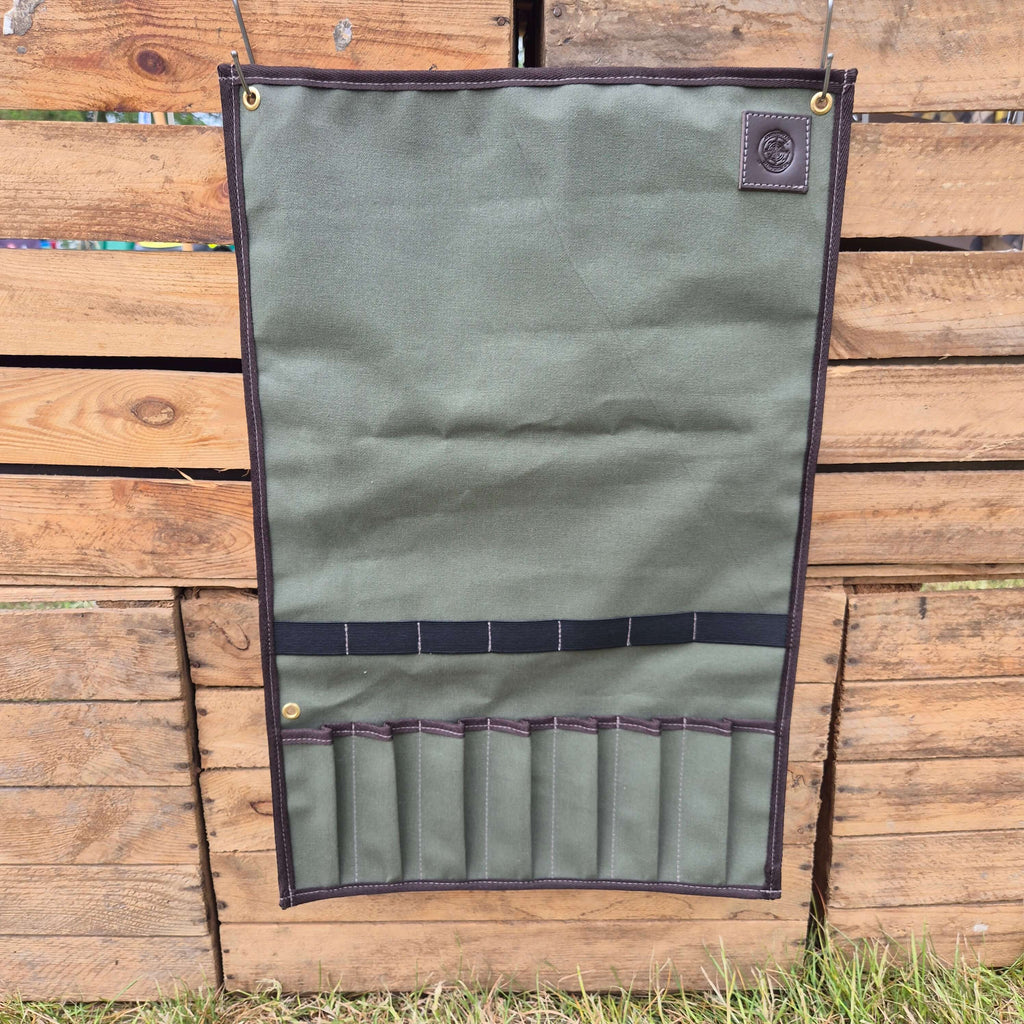 Camp Cookup Toolroll for safely storing kitchen utensils, measuring 35cm x 45cm, shown against a wooden backdrop.