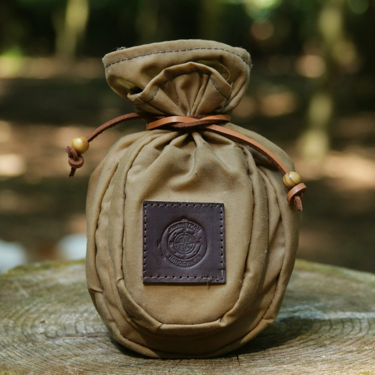 A Sami style wax canvas coffee pouch with a front pocket