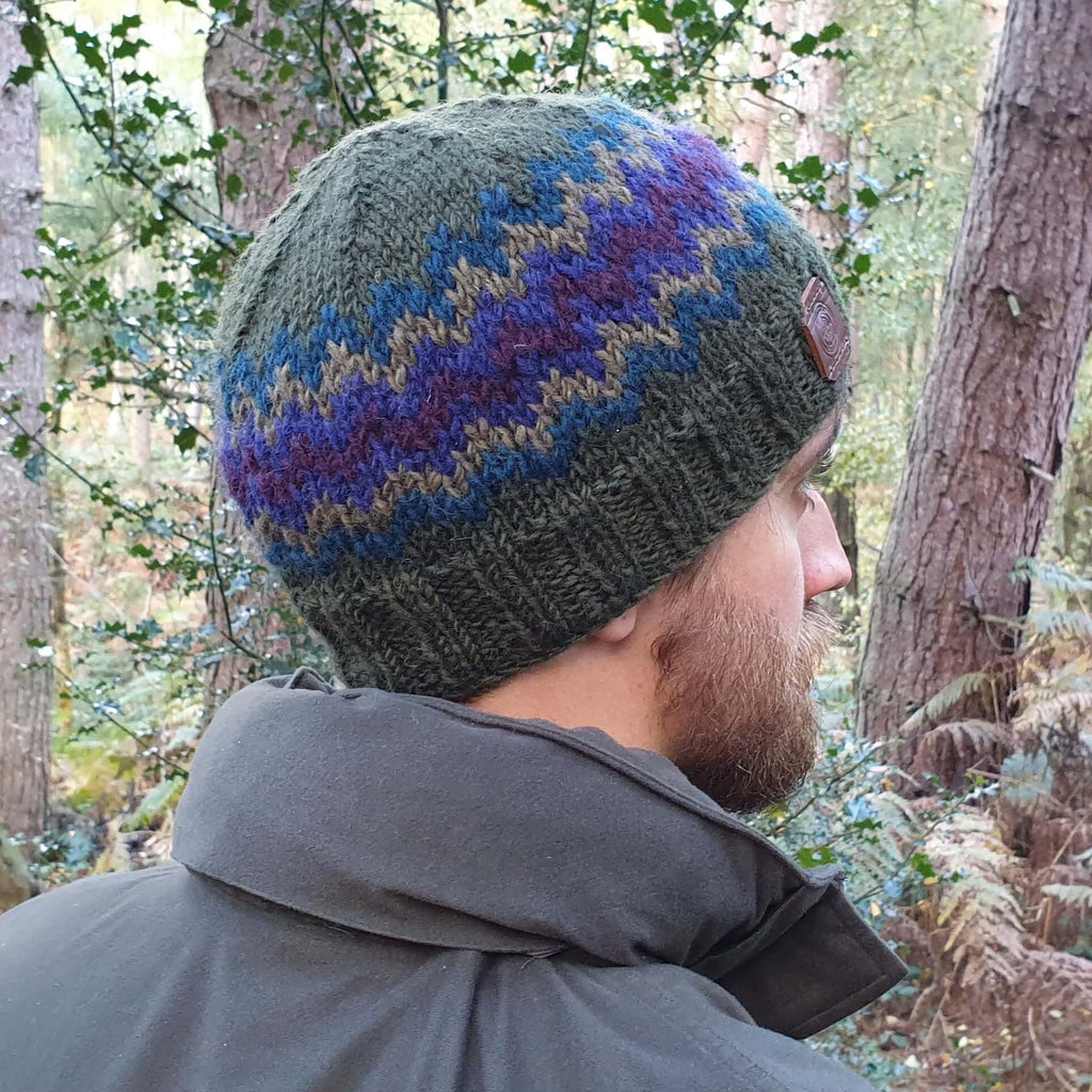 Green wool zig zag pattern beanie hat with a leather tab