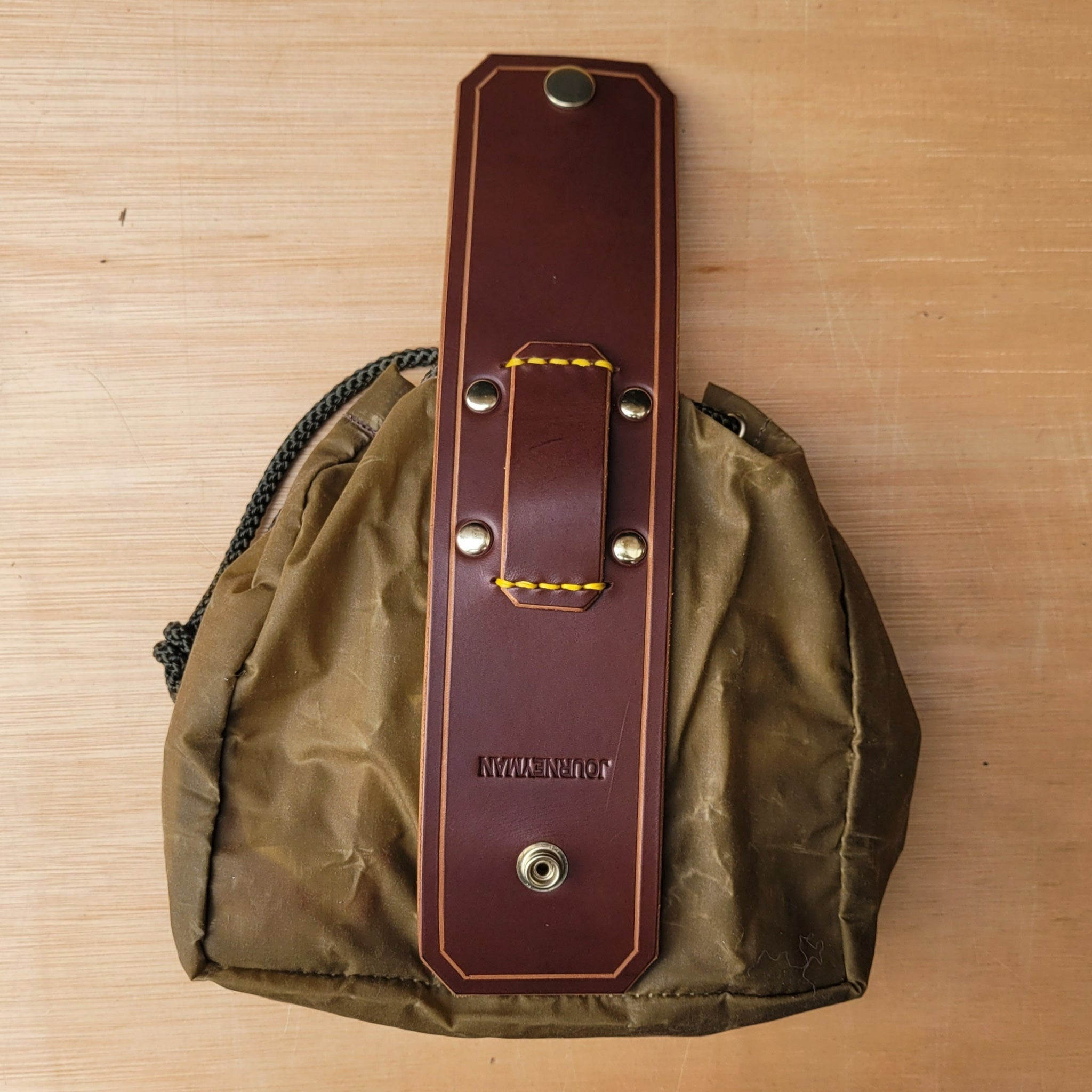 Forager dump pouch made from wax canvas and leather, used for foraging in the woods