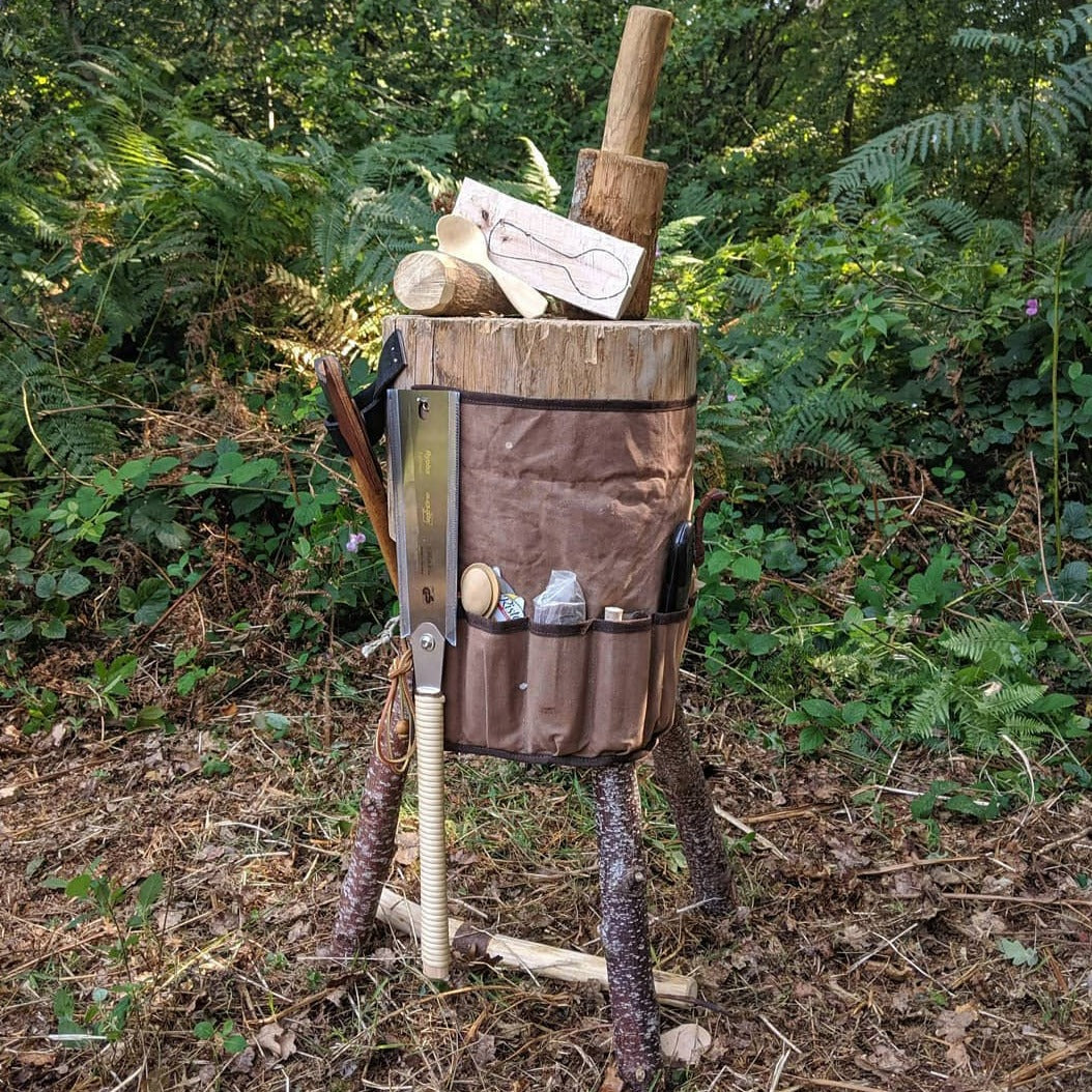 Brown canvas tool roll in the woods.