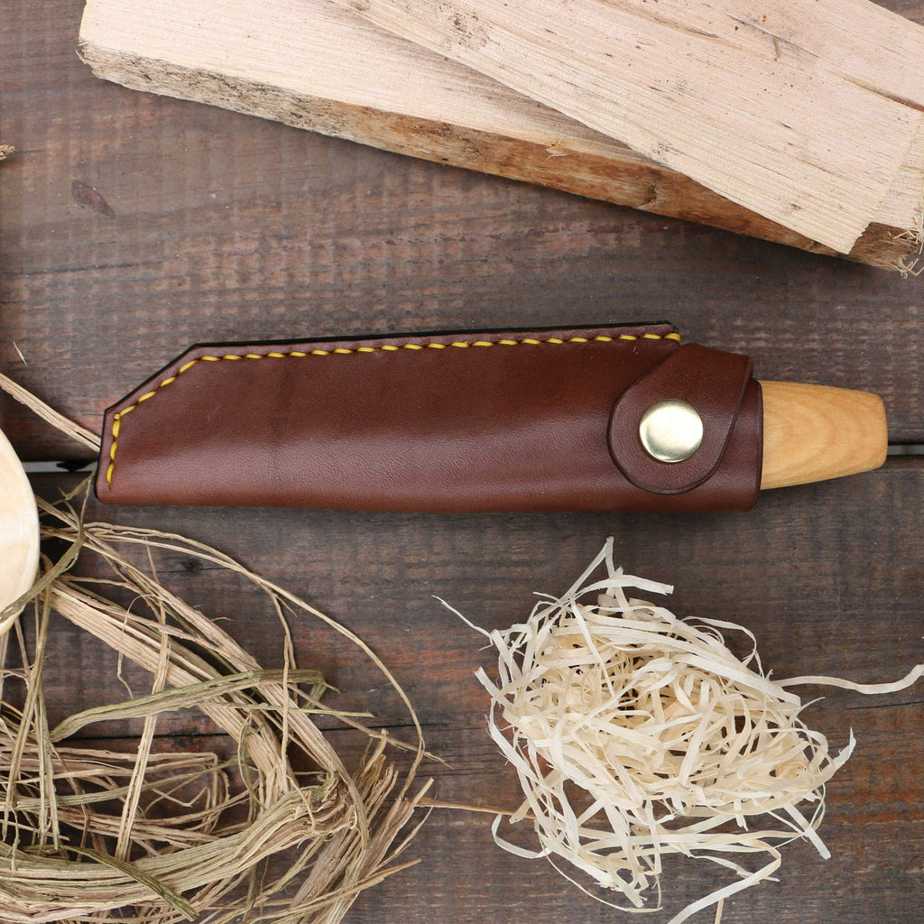 A brown handstitched leather knife sheath for the Mora 106