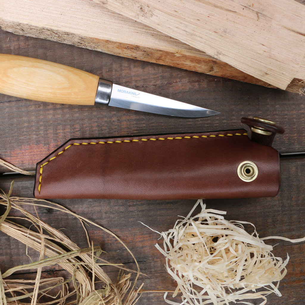 A brown handstitched leather knife sheath for the Mora 106