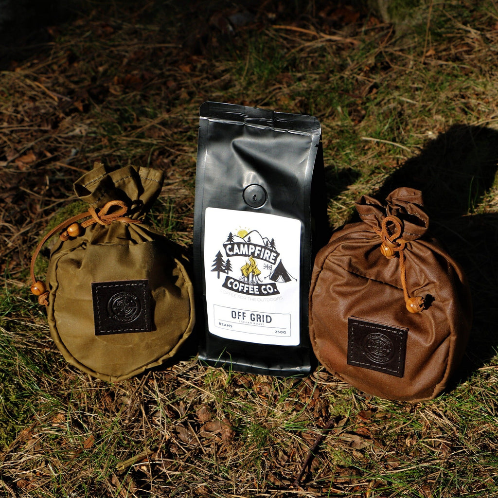 Wax canvas sami coffee pouches in the woods with a bag of coffee beans